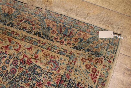 A Caucasian rug with triple medallion on a blue ground and two worn Persian rugs 210 x 120cm, 205 x 135cm and 195 x 145cm